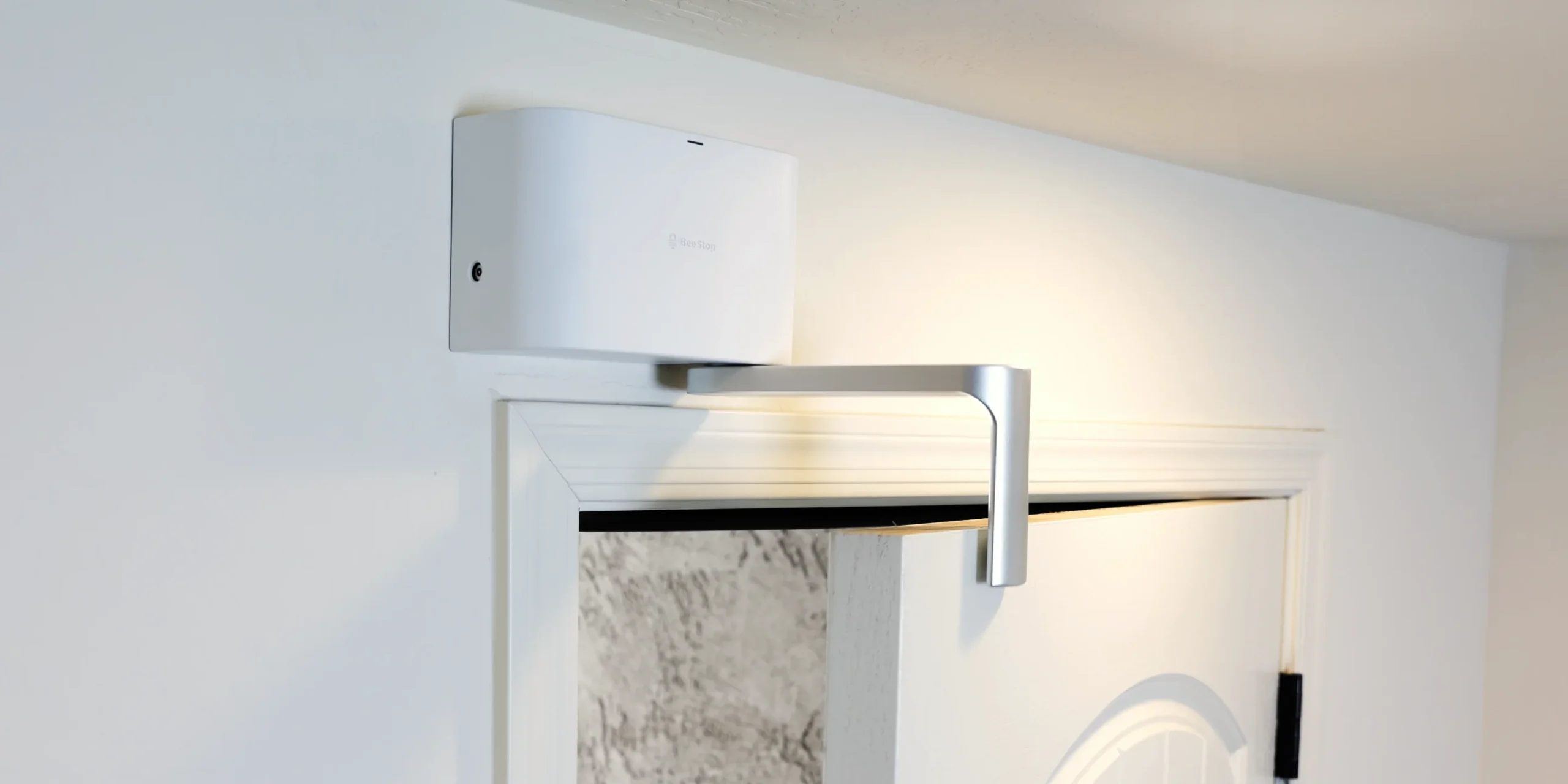 The Guard in Pass-Thru mode, its arm holding a door partly open